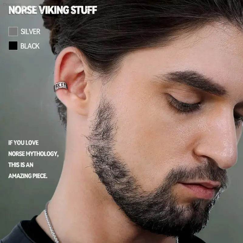 Silver ear cuff with runes.