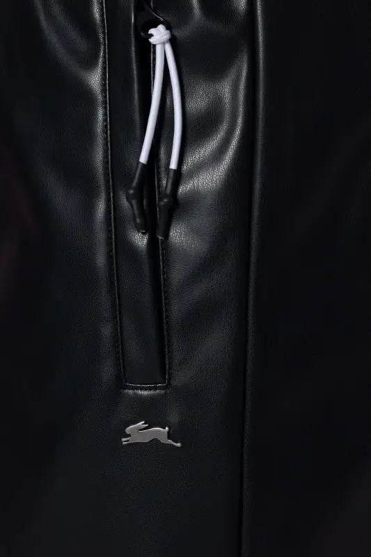 Black faux leather pants with drawstring and rabbit logo.