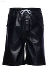 Black faux leather shorts.