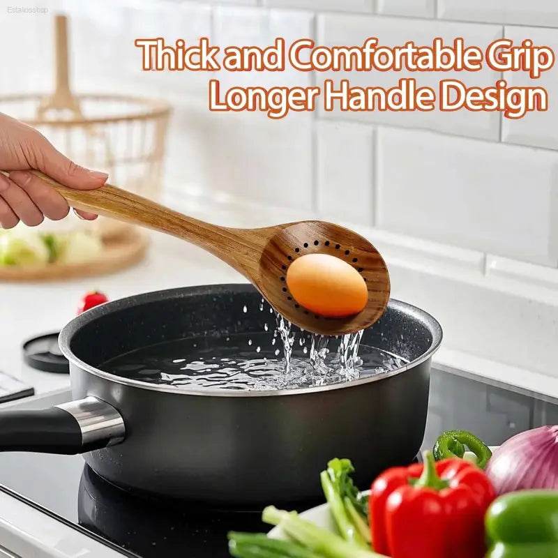 Wooden slotted spoon holding an egg over a pot of boiling water.