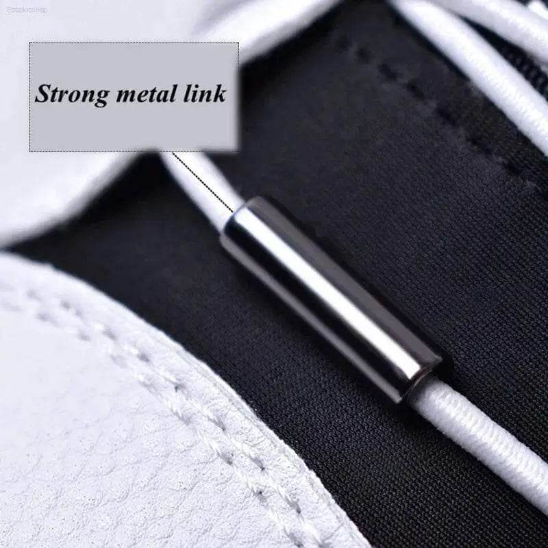 Shiny metal link on white cord.