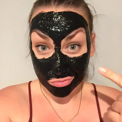 Woman using Vegan Activated Charcoal Peel for a refreshing skincare boost