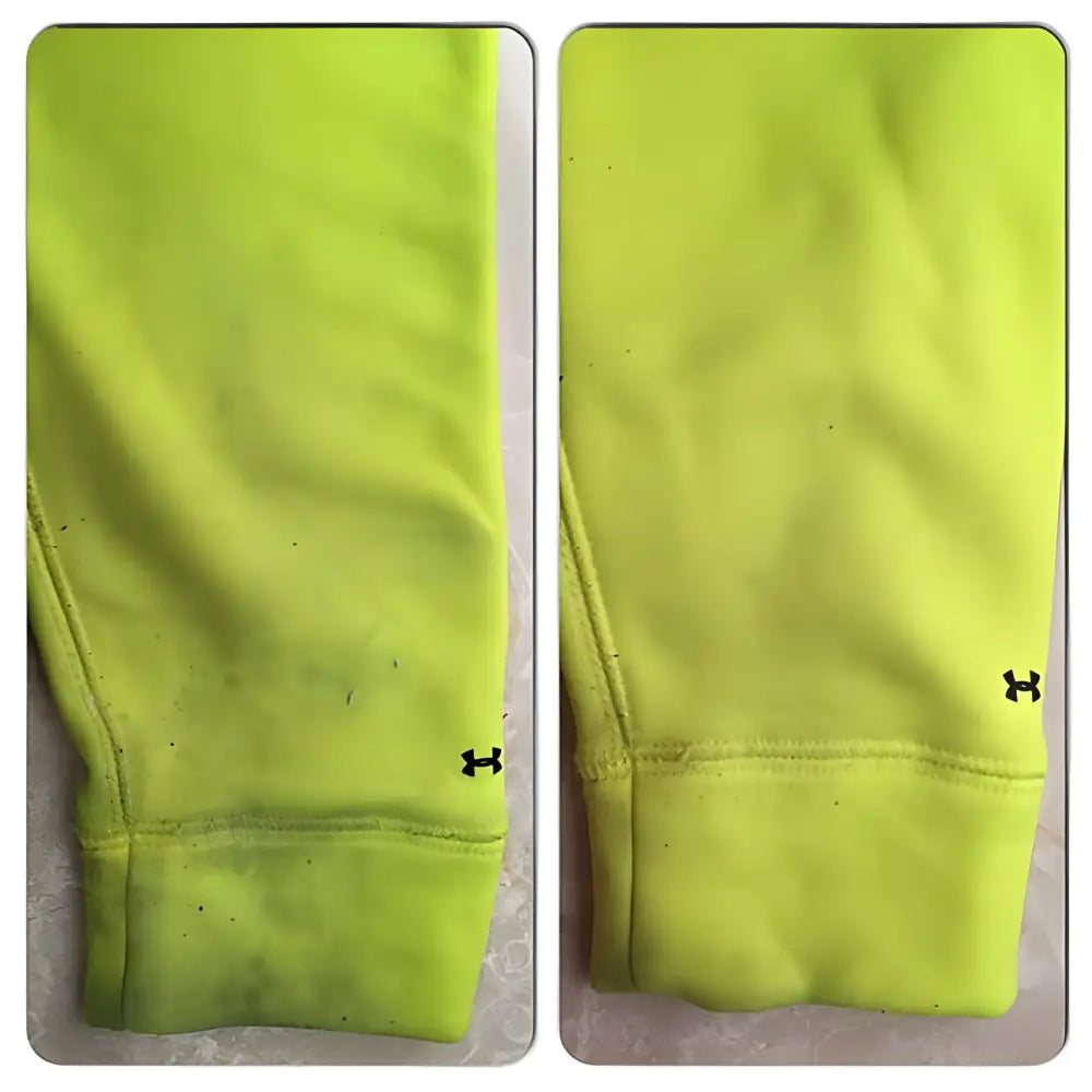 Neon yellow sweatshirt sleeves, one dirty, spotlighting Vegan Stain Stick’s magic