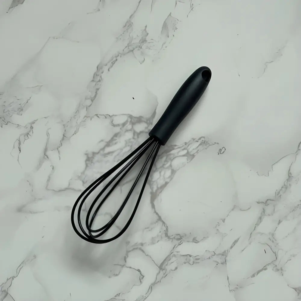 Black handled whisk from Vibrant Mini Silicone Whisks, a silicone whisk essential for cooking