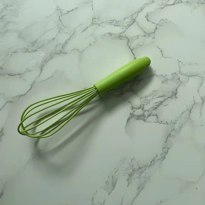 Green handled Vibrant Mini Silicone Whisk, a must-have silicone whisk essential