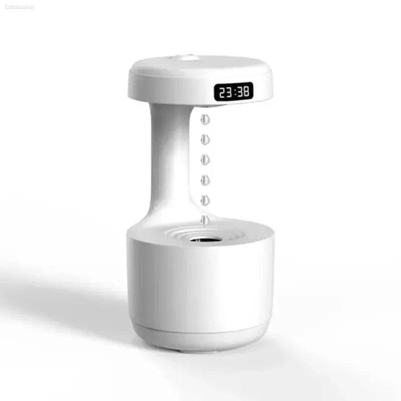 White gravity-defying water drop humidifier with digital clock.