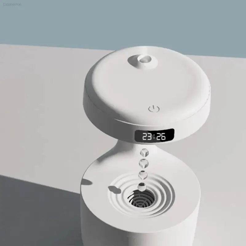 White humidifier with digital clock.