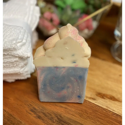 Cupcake-shaped soap with blue and white layers, perfect for cotton candy soap lovers