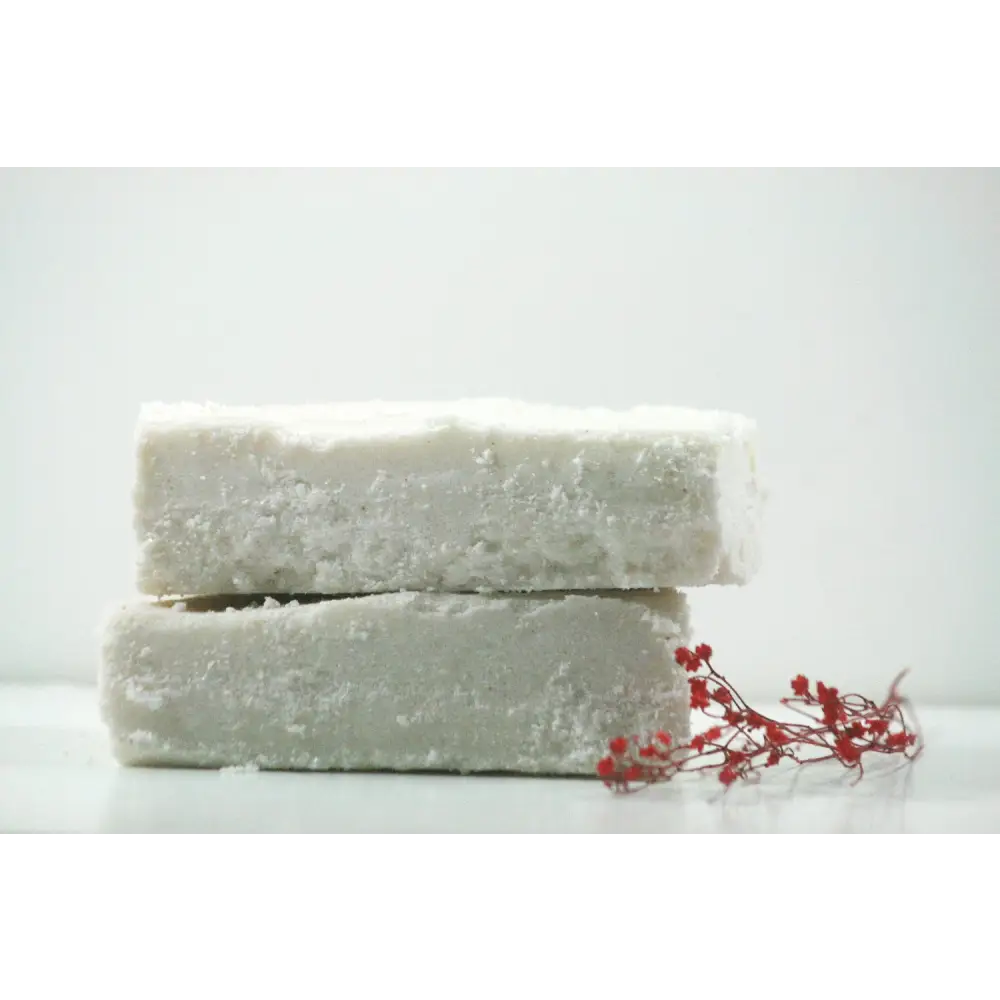 Stacked white soap bars from Winter Calm Sea Salt Bar Duo for a refreshing cleanse