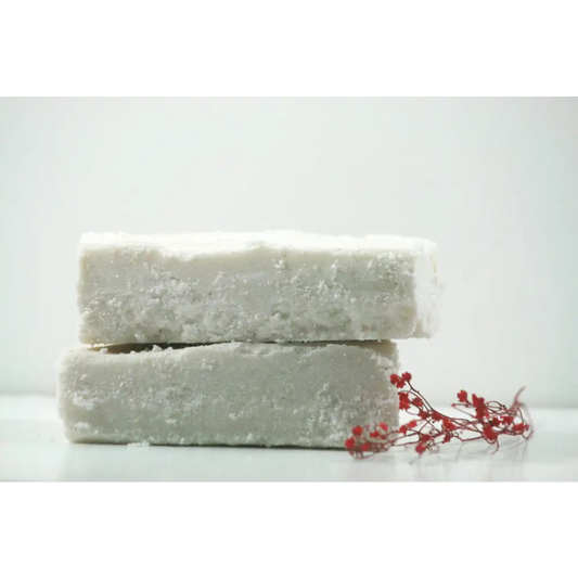 Stacked white soap bars from Winter Calm Sea Salt Bar Duo for a refreshing cleanse