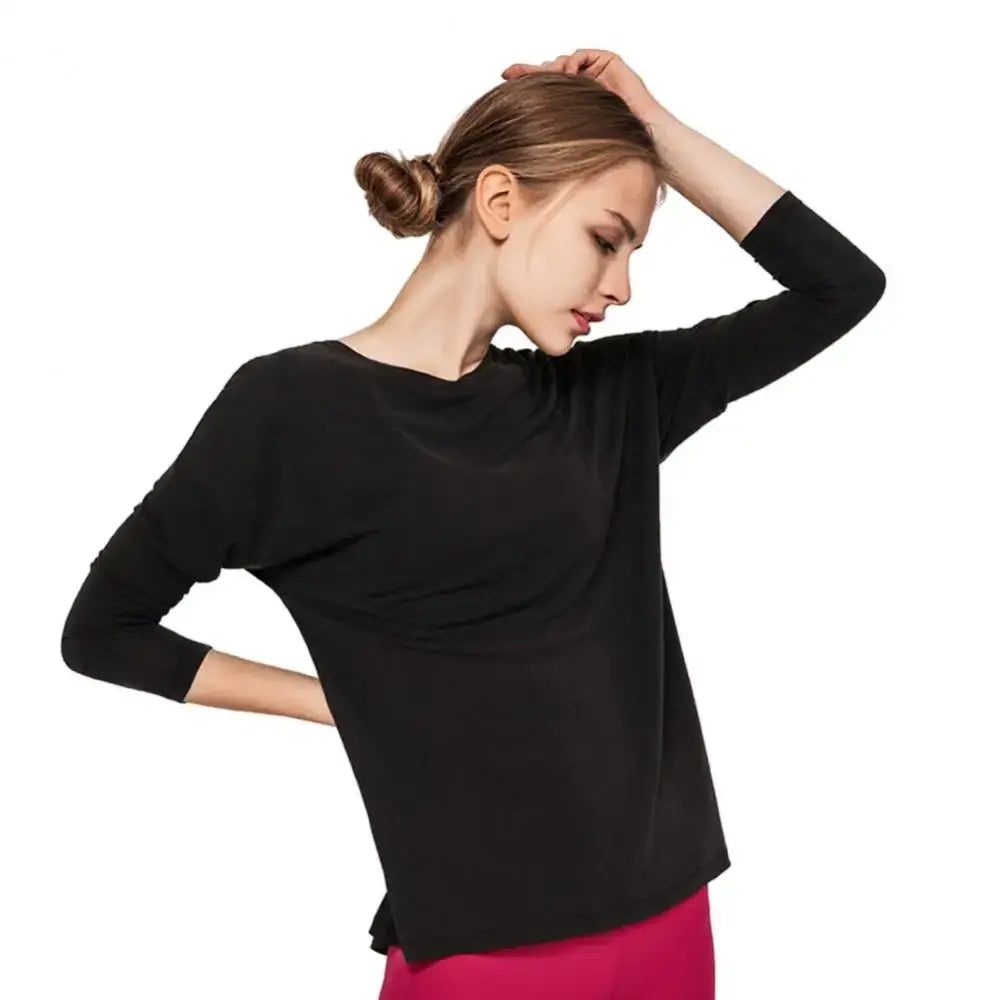 Woman in black long-sleeved shirt featuring cross round neck, perfect for fast dry running