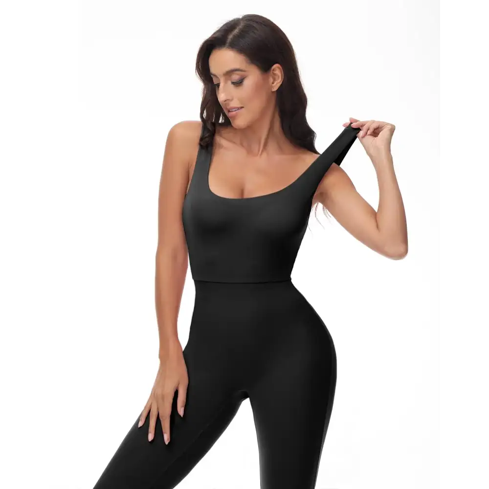 Black form-fitting workout flare jumpsuit, perfect as a backless yoga romper for gym wear