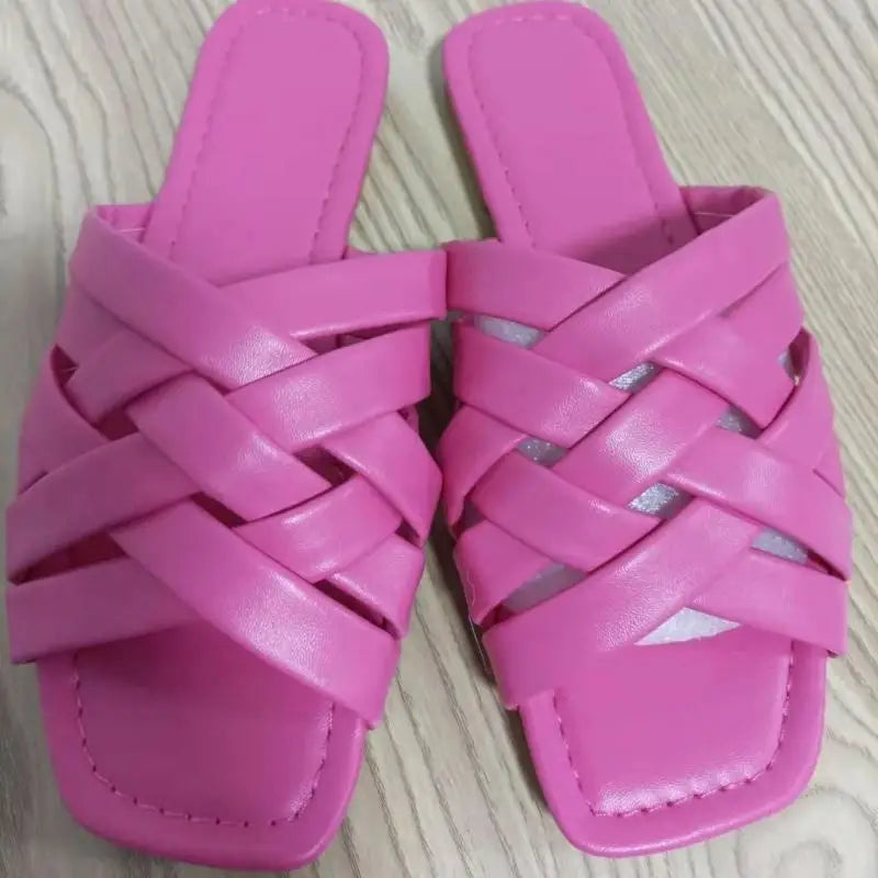 Pair of pink woven slide sandals perfect for comfy summer vibes and stylish looks