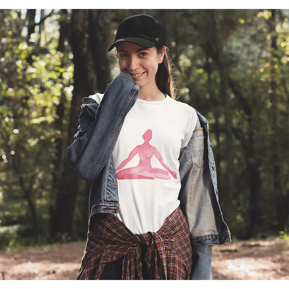 Woman’s white t-shirt featuring a pink yoga meditation pose print for relaxed vibes