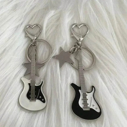 Guitar-shaped keychains with star charms from the Zakol Y2K Guitar Love collection