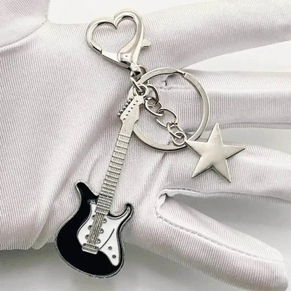 Guitar and star keychain from Zakol Y2K Guitar Love adds charm to your style